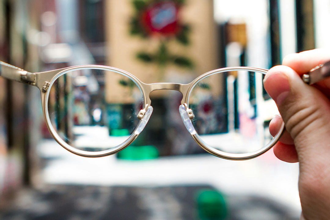 Image for Blurry eyeglasses held up to the light, symbolizing how authenticity in healthcare branding is often overlooked or seen unclearly in marketing efforts.teaser