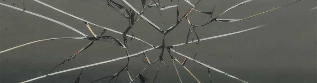Shattered glass as a metaphor for reputation under pressure for healthcare organizations. Even the smallest cracks in your strategy can spread and affect patient trust long before a PR crisis happens